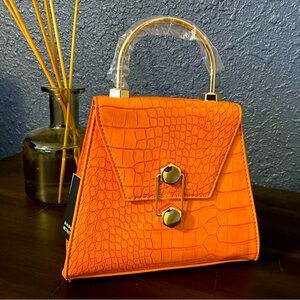 Trapezoid cross body/strap included!